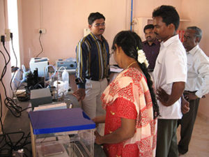 CIKS staff participating in demonstration of soil testing